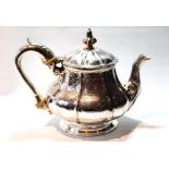 Victorian silver teapot of embossed octagonal pear shape on moulded circular foot, by William Eaton,