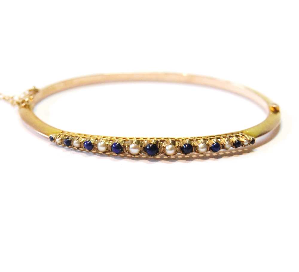 9ct gold hinged bangle with lapis lazuli and pearls, 1898, 6g.