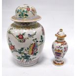 Famille rose jar and cover decorated with blossom, 22cm high, and another, smaller, with armorial