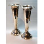 Pair of silver vases of plain tapering shape, Birmingham 1910, loaded, 25cm.