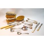 Three silver sugar tongs, a dessert spoon, 1862, four items of dessert cutlery, three mounted