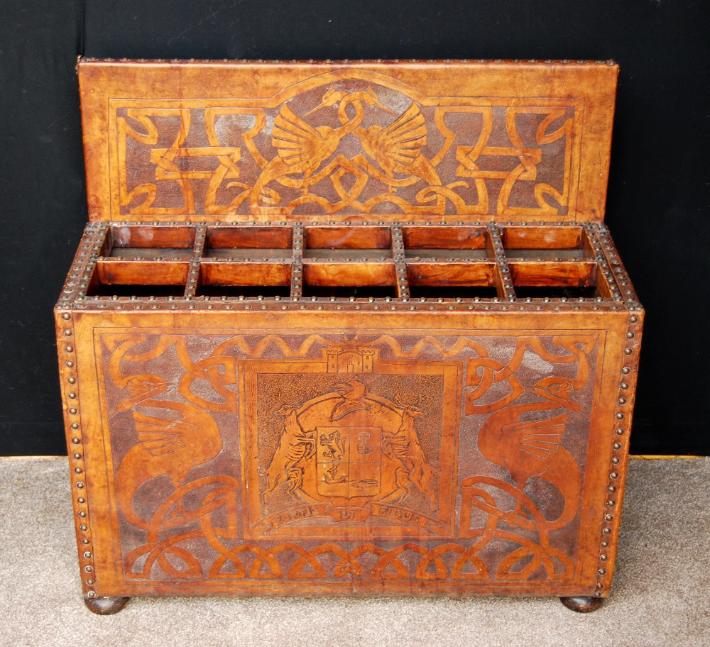 Tooled leather stick stand with armorial Fortis et Fidus, decorated with serpents and cranes, on bun