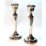 Pair of silver table candlesticks with tapering stems, 22.5cm, loaded.