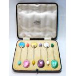 Set of six silver and polychrome enamel coffee spoons, 1938, cased.