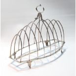 Silver toast rack for eight, with plain wires on oval vase and shaped feet, by Abstainando King,