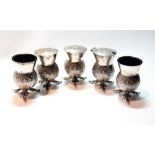 Silver four-piece condiment set modelled as thistles upon triple leafage supports, by Hamilton &