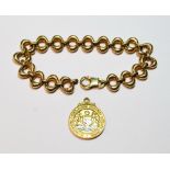 9ct gold bracelet of oval links and a similar medallion, 17g. (2)