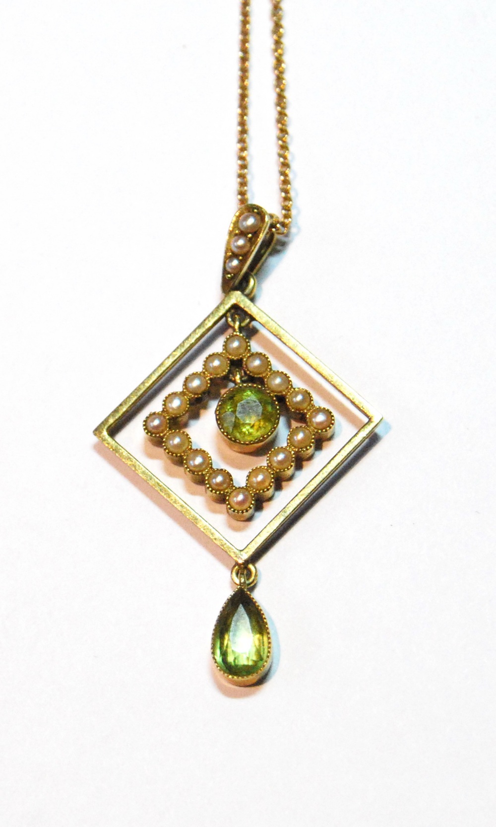 Edwardian gold square pendant with two peridot and pearls, '15'.