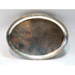 Silver oval waiter or teapot stand with moulded and beaded border, maker's mark overstruck, (?)W.B.,