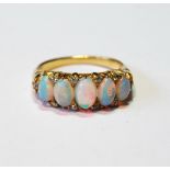 Edwardian gold half hoop ring with five opals and diamond points, in gold, probably 18ct, size L.