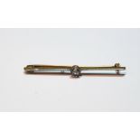 Bar brooch with old-cut diamond brilliant, approximately .4ct, millegrain-set in gold.