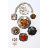 Silver plaid brooch with cairngorm, another with various agates, and seven other items.