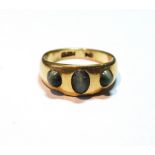 18ct gold ring with three quartz cat's eyes, Chester 1897, size Q½, 8.2g.