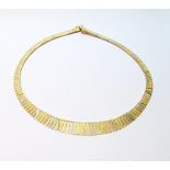 Coloured gold necklet of graduated batons, '750', 41.4g.