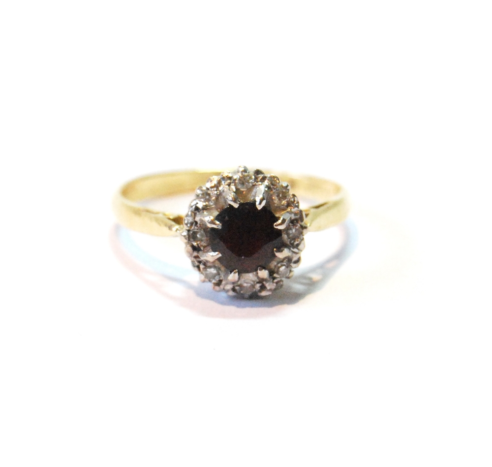 Diamond and garnet cluster ring in 18ct gold, size T.