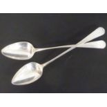 Pair of silver serving spoons, initialled, of typical pointed shape. Makers mark obliterated,