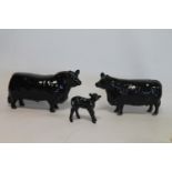 Three Beswick figures: Aberdeen Angus Bull, no. 1562, 11.5cm high; Aberdeen Angus Cow, no. 1563,