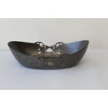 Liberty & Co. English pewter dish of oval form with pierced entrelac decoration, impressed marks and