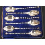 Set of six silver ice spoons with twisted stems, probably Polish c.1890. Cased.