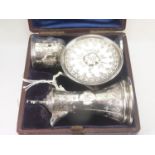 Victorian silver portable communion set engraved and applied with bosses, chalice, paten and ewer of