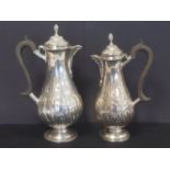 Pair of silver cafe au lait pots of Georgian style, embossed pear shape, by Thomas Bradbury, 1897/8.