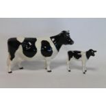 Two Beswick figures: Friesian Cow Ch. "Claybury Leegwater", no. 1362A, gloss, 12cm high and Friesian