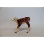 Beswick figure Hereford Calf, no. 854, brown and white gloss, 12cm high.