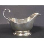 Silver sauce boat with reeded edge upon oval foot, 1934.