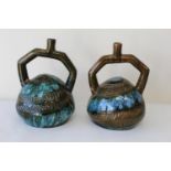 Pair of Christopher Dresser Linthorpe Pottery Peruvian handled vases, the globular bodies with