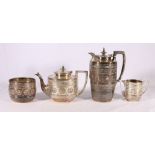 An Edward & Son of Glasgow zodiac decorated white metal coffee pot and matching sugar bowl, and a