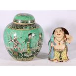 A 20th Century Chinese famille verte ginger jar decorated with deities standing on sea creatures and