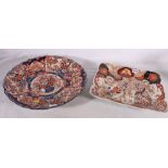 An unusual Japanese Imari dish of fluted rectangular form decorated with diaper and flower shaped