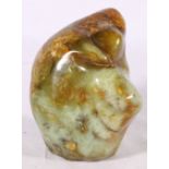 A Chinese hardstone boulder or scholar's stone in mottled green and brown hardstone, 15.5 cm x 14