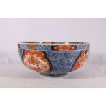 Late 19th Century Japanese Imari deep bowl decorated with panels of confronting phoenix and bats