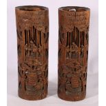 Pair of early 20th Century Chinese bamboo column vases depicting figures in a landscape.