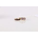 9ct gold garnet five stone dress ring size K, 2.6g and an un-hallmarked yellow metal amethyst