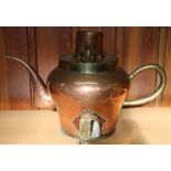 Very large copper and brass teapot with reserve for heated coals at the base to heat the