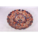 Japanese Imari dish with fluted edge, the central panel of a basket of flowers surrounded by an