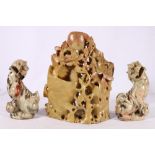 A pair of Chinese carved soapstone lion dogs 14.5 cm and a soapstone triple vase in the form of