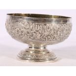 An Indian silver raised dish decorated with images of deities, 253g