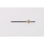 White metal bar brooch set with approximately 0.15ct diamond encircled by eight round pearls, 3.27g,