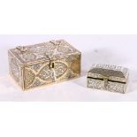 Two Islamic boxes both of rectangular section, the larger inlaid with copper and silver and wood