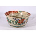 A Kutani deep bowl decorated with figures to an interior flower sprays to the exterior, Kutani