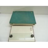 Book Binding Equipment.  Two developing trays; a piece of silk screen fabric for paper repair; two