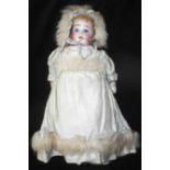 German bisque headed doll. 27cm high. Possibly made by Ernst Heubach. In good condition.
