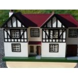 Dolls house. 1940's style, metal windows, double front openings, attached garage, includes various