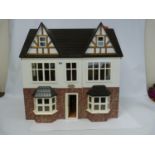 Doll's house with electrics. 61cm high x 62cm wide x 45cm deep.