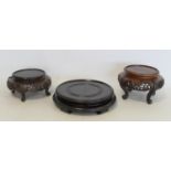 Chinese circular hardwood low stand with five bracket feet, 23cm diameter (top to fit 19cm), and two