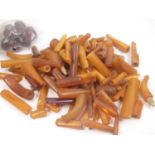 Quantity of amber pipe and cigarette holder mouthpieces. 345g.