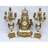 Imperial gilt metal mounted three piece mantel clock garniture, the clock with circular dial stamped